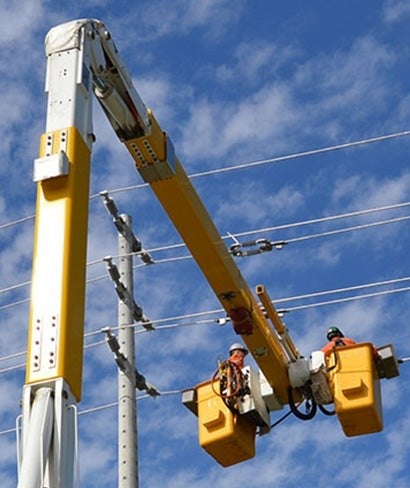 close up of people working on power lines